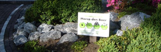 Rotstuin in aanleg met bord van Hoveniersbedrijf Marco den Boer